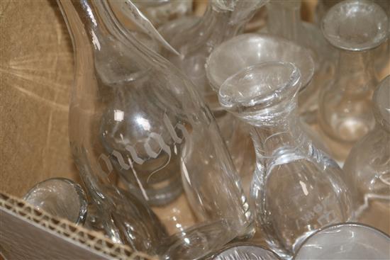 A quantity of glass decanters lacking stoppers